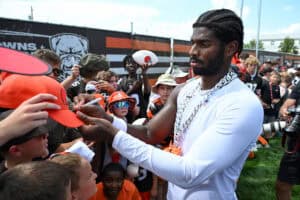 BEREA, OHIO - JULY 28: Shedeur Sanders #12 of the Cleveland Browns signs autographs after Cleveland Browns training camp at CrossCountry Mortgage Campus on July 28, 2025 in Berea, Ohio.