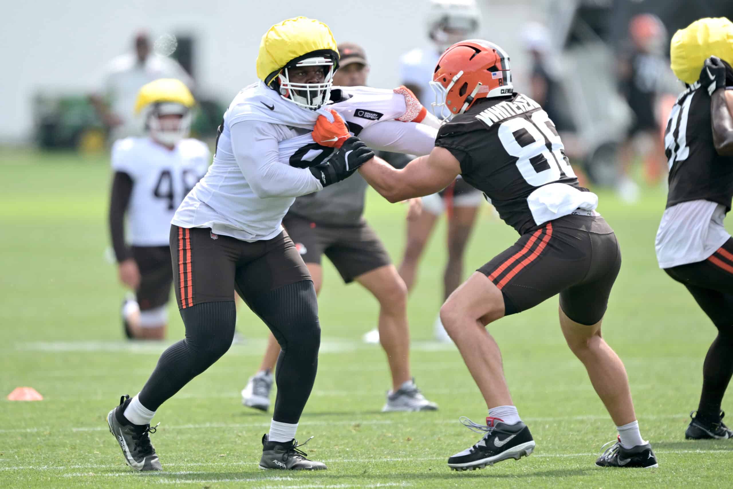 BEREA, OHIO - JULY 25: Defensive end Adin Huntington #66 and tight end Blake Whiteheart #86 of the Cleveland Browns run a play during training camp at CrossCountry Mortgage Campus on July 25, 2025 in Berea, Ohio.