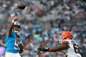 CHARLOTTE, NORTH CAROLINA - AUGUST 08: Quarterback Bryce Young #9 of the Carolina Panthers scrambles out of pocket prior to throwing a touchdown to teammate wide receiver T.J. Luther #81 in the first half during the NFL Preseason 2025 game against the Cleveland Browns at Bank of America Stadium on August 08, 2025 in Charlotte, North Carolina.