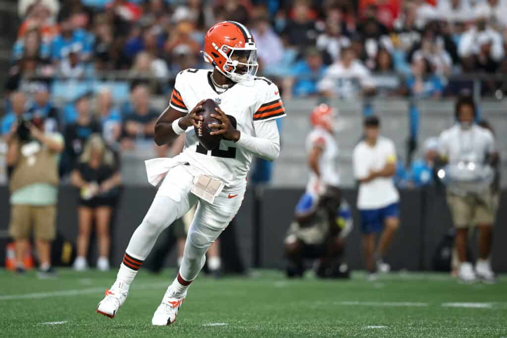 CHARLOTTE, NORTH CAROLINA - AUGUST 08: Quarterback Shedeur Sanders #12 of the Cleveland Browns drops to pass in the first half during the NFL Preseason 2025 game against the Carolina Panthers at Bank of America Stadium on August 08, 2025 in Charlotte, North Carolina.