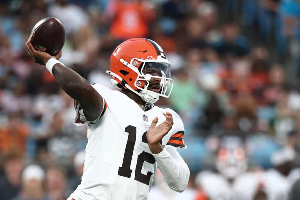CHARLOTTE, NORTH CAROLINA - AUGUST 08: Quarterback Shedeur Sanders #12 of the Cleveland Browns drops to pass in the first half during the NFL Preseason 2025 game against the Carolina Panthers at Bank of America Stadium on August 08, 2025 in Charlotte, North Carolina.