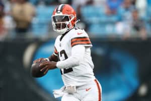 CHARLOTTE, NORTH CAROLINA - AUGUST 08: Quarterback Shedeur Sanders #12 of the Cleveland Browns drops to pass in the first half during the NFL Preseason 2025 game against the Carolina Panthers at Bank of America Stadium on August 08, 2025 in Charlotte, North Carolina.