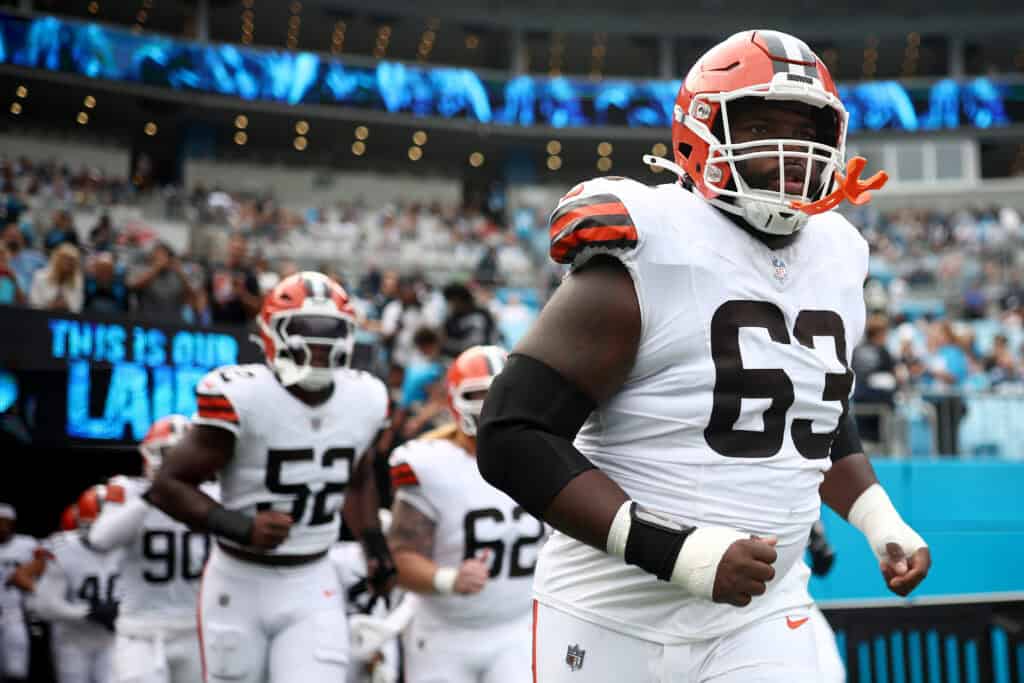 CHARLOTTE, NORTH CAROLINA - AUGUST 08: Defensive tackle Ralph Holley #63 of the Cleveland Browns runs onto the field prior to the NFL Preseason 2025 game against the Carolina Panthers at Bank of America Stadium on August 08, 2025 in Charlotte, North Carolina.