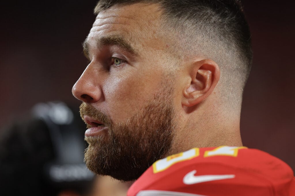KANSAS CITY, MISSOURI - AUGUST 22: Travis Kelce #87 of the Kansas City Chiefs watches the game from the sidelines during the second quarter during the NFL Preseason 2025 game between Chicago Bears and Kansas City Chiefs at Arrowhead Stadium on August 22, 2025 in