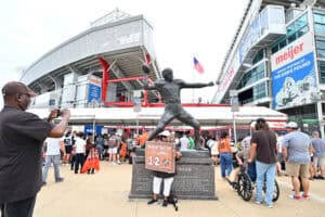 CLEVELAND, OHIO - AUGUST 23: Fans take a photo with a statue of Otto Graham outside Huntington Bank Field before the NFL Preseason 2025 game between Los Angeles Rams and Cleveland Browns on August 23, 2025 in Cleveland, Ohio.
