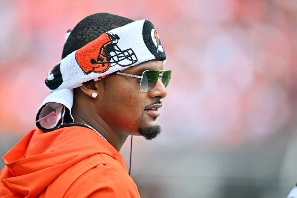 CLEVELAND, OHIO - AUGUST 23: Quarterback Deshaun Watson #4 of the Cleveland Browns watches on the sidelines of an NFL Preseason 2025 game against the Los Angeles Rams at Huntington Bank Field on August 23, 2025 in Cleveland, Ohio.