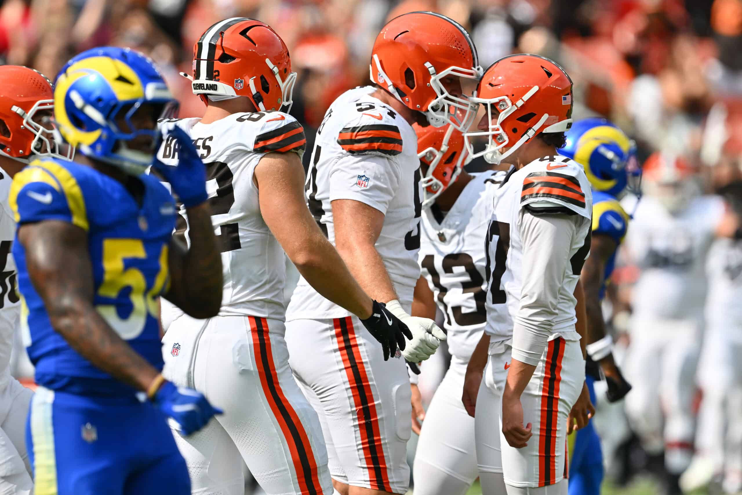 CLEVELAND, OHIO - AUGUST 23: Offensive tackle Kilian Zierer #54 celebrates with place kicker Andre Szmyt #47 of the Cleveland Browns after Szmyt kicked the game winning field goal in the last seconds of an NFL Preseason 2025 game against the Los Angeles Rams at Huntington Bank Field on August 23, 2025 in Cleveland, Ohio. The Browns defeated the Rams 19-17.