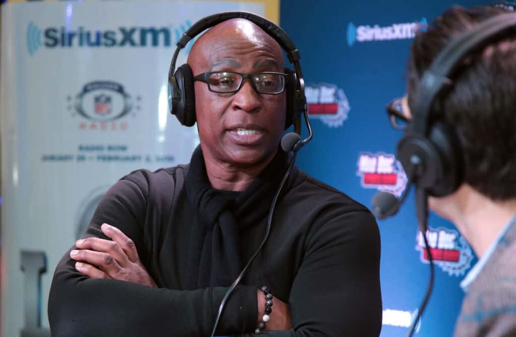 BLOOMINGTON, MN - FEBRUARY 01: Former NFL player and NFL Hall of Fame player Eric Dickerson (L) and SiriusXM radio host Adam Schein attend SiriusXM at Super Bowl LII Radio Row at the Mall of America on February 1, 2018 in Bloomington, Minnesota.
