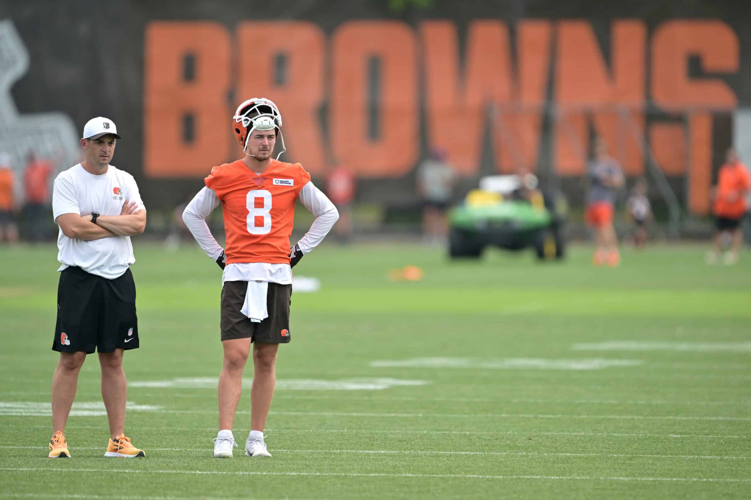 BEREA, OHIO - JULY 25: Offensive coordinator Tommy Rees and quarterback Kenny Pickett #8 of the Cleveland Browns look on during training camp at CrossCountry Mortgage Campus on July 25, 2025 in Berea, Ohio.