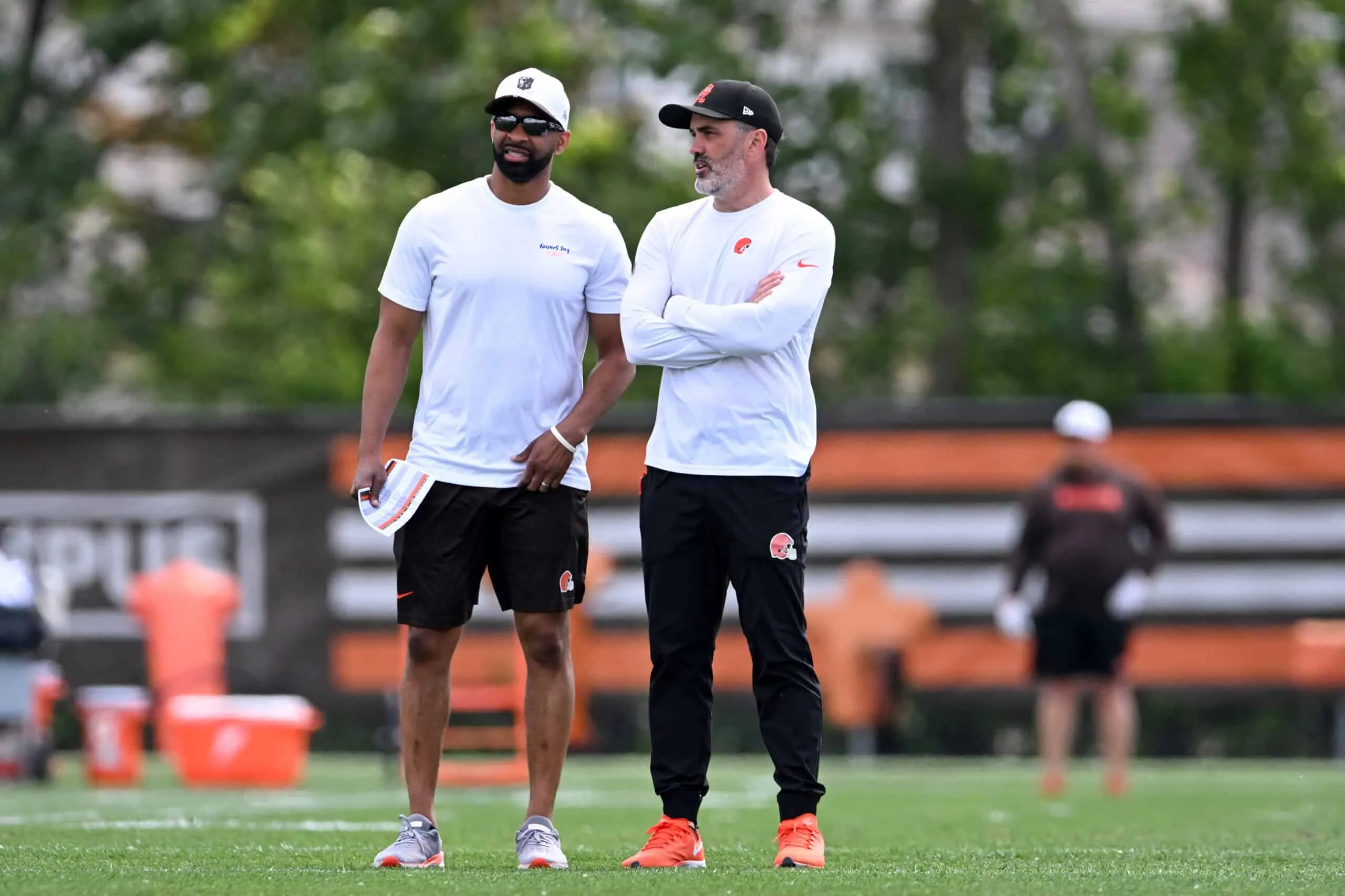 BEREA, OHIO - JUNE 10: Executive vice president, football operations & general manager Andrew Berry of the Cleveland Browns talks with head coach Kevin Stefanski during Cleveland Browns mandatory minicamp at CrossCountry Mortgage Campus on June 10, 2025 in Berea, Ohio.