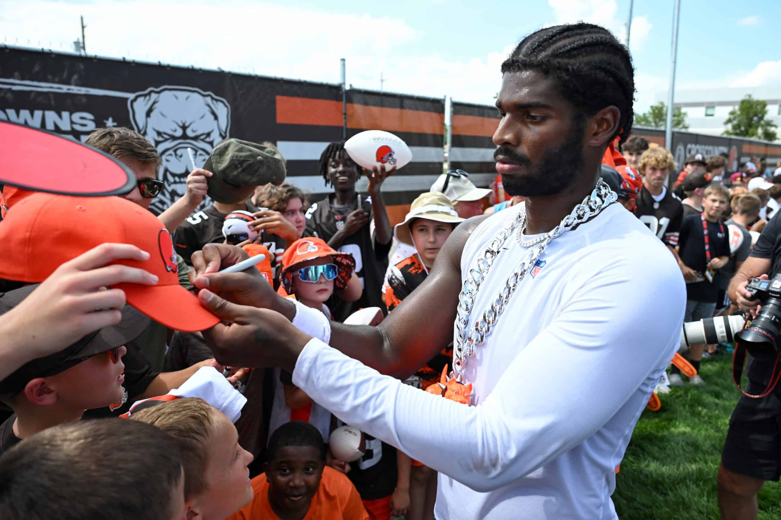 BEREA, OHIO - JULY 28: Shedeur Sanders #12 of the Cleveland Browns signs autographs after Cleveland Browns training camp at CrossCountry Mortgage Campus on July 28, 2025 in Berea, Ohio.