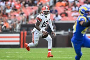 CLEVELAND, OHIO - AUGUST 23: Shedeur Sanders #12 of the Cleveland Browns carries the ball during the third quarter of an NFL Preseason 2025 game against the Los Angeles Rams at Huntington Bank Field on August 23, 2025 in Cleveland, Ohio.