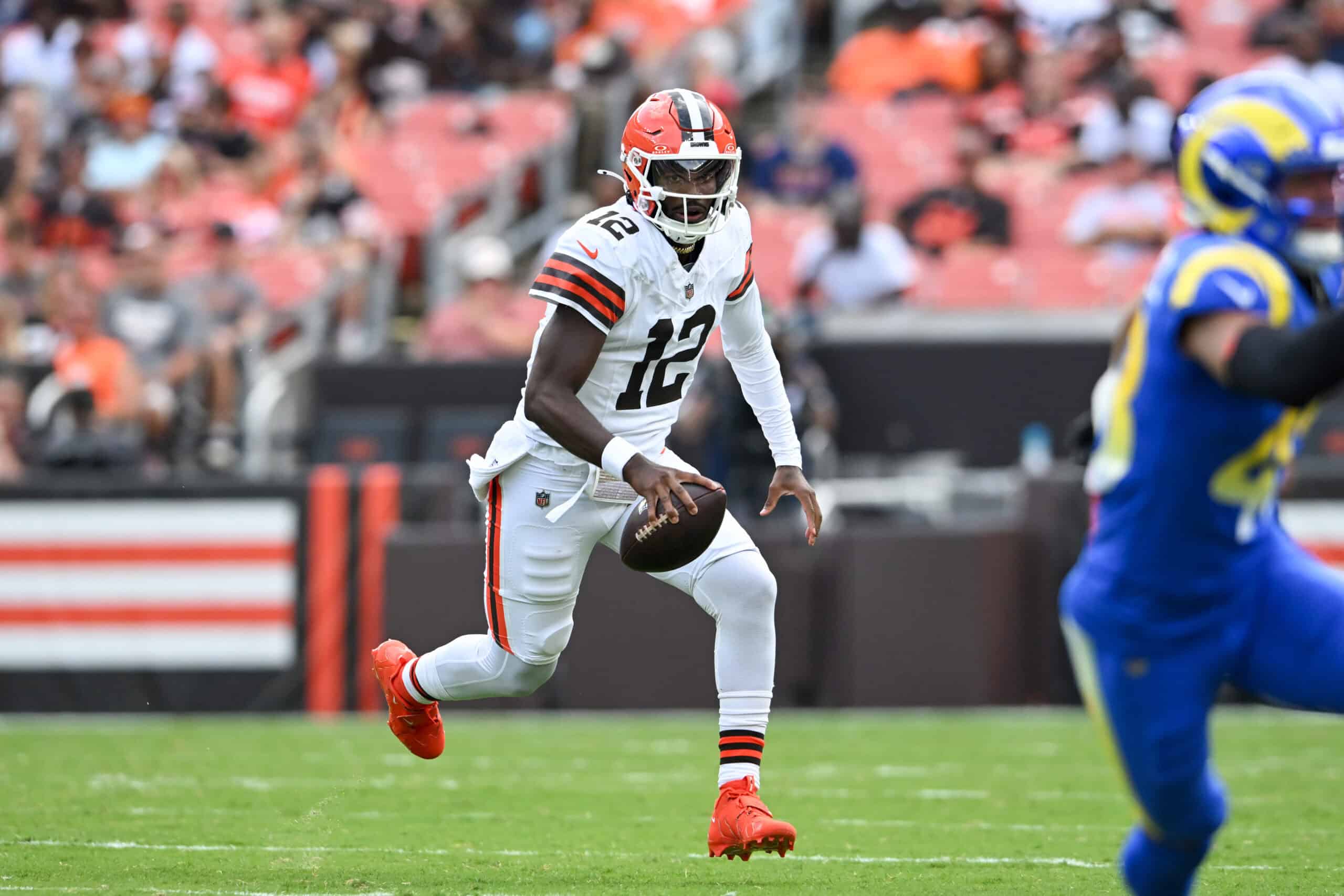 CLEVELAND, OHIO - AUGUST 23: Shedeur Sanders #12 of the Cleveland Browns carries the ball during the third quarter of an NFL Preseason 2025 game against the Los Angeles Rams at Huntington Bank Field on August 23, 2025 in Cleveland, Ohio.