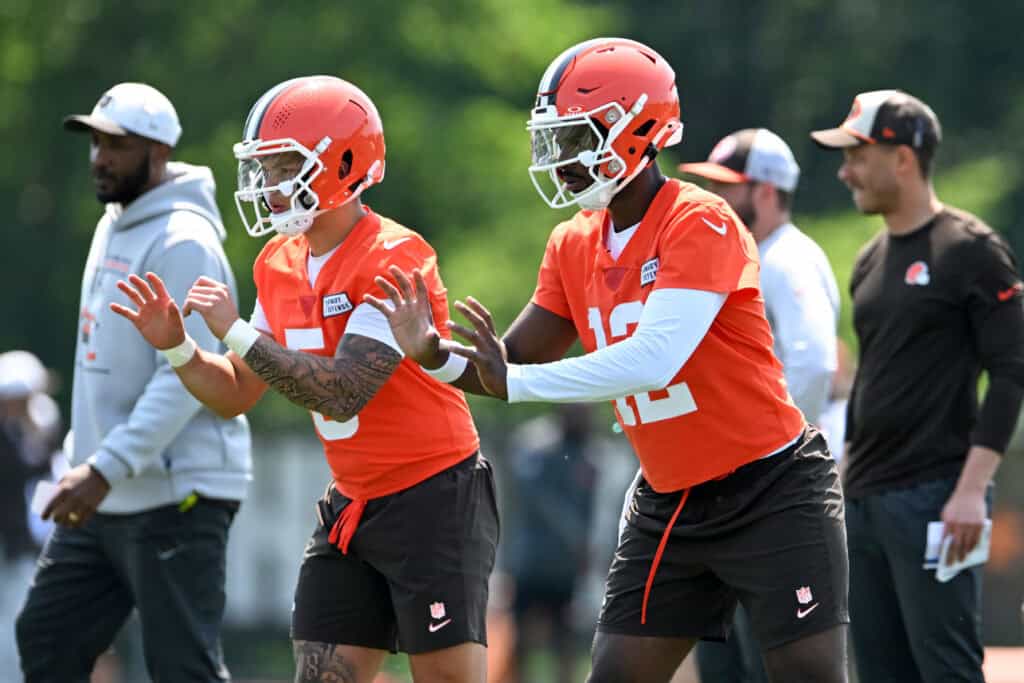 BEREA, OHIO - JUNE 11: Shedeur Sanders #12 and Dillon Gabriel #5 of the Cleveland Browns run a drill during Cleveland Browns mandatory minicamp at CrossCountry Mortgage Campus on June 11, 2025 in Berea, Ohio.