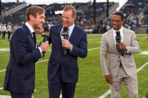CANTON, OHIO - AUGUST 04: (L to R) NBC Sports commentators Jac Collinsworth, Chris Simms and Rodney Harrison laugh during a segment prior to the 2022 Pro Hall of Fame Game between the Jacksonville Jaguars and the Las Vegas Raiders at Tom Benson Hall of Fame Stadium on August 04, 2022 in Canton, Ohio.