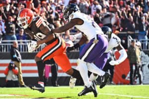CLEVELAND, OHIO - OCTOBER 27: Cedric Tillman #19 of the Cleveland Browns scores a touchdown against Trenton Simpson #23 of the Baltimore Ravens in the third quarter of a game at Huntington Bank Field on October 27, 2024 in Cleveland, Ohio.