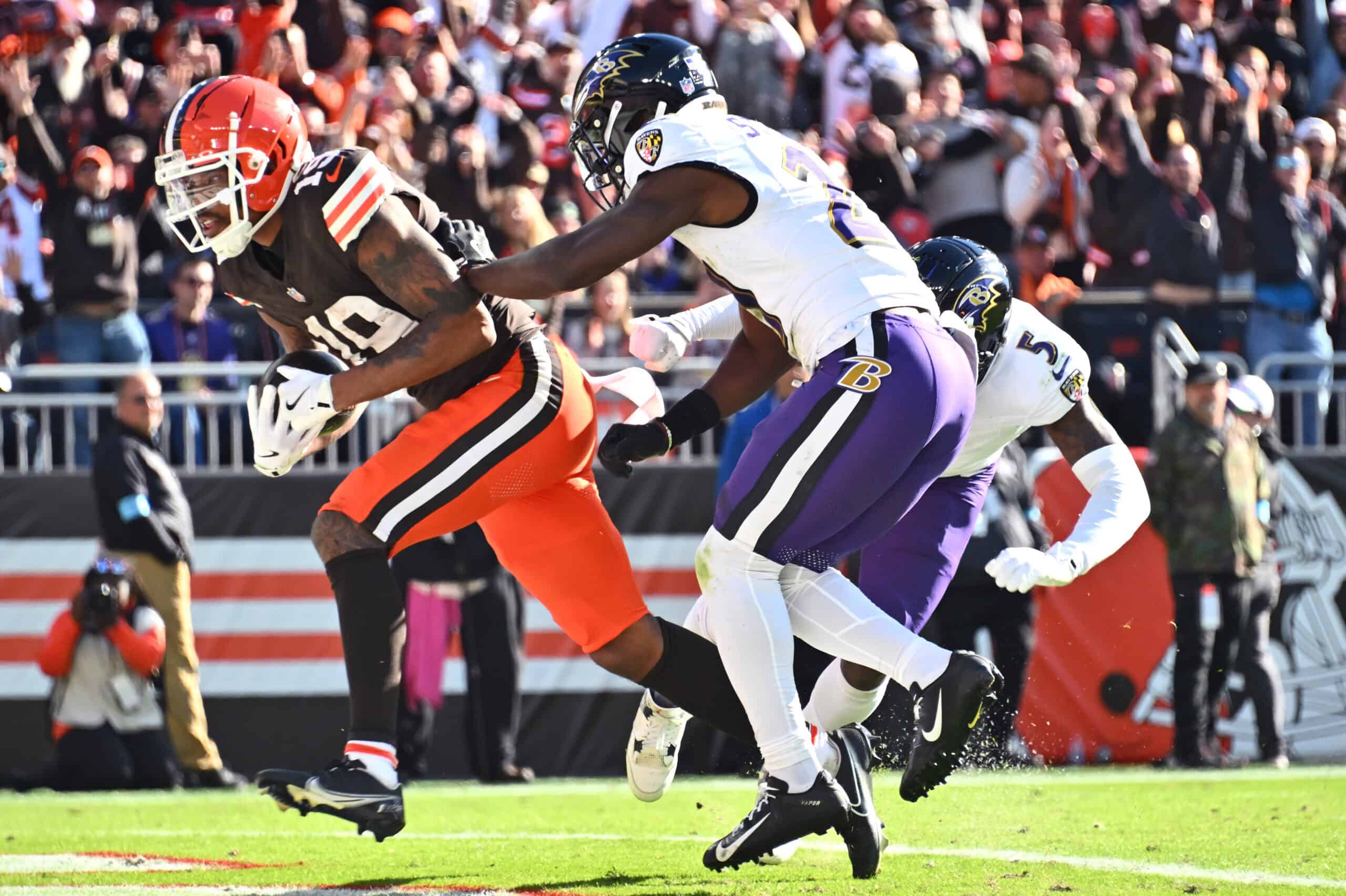 CLEVELAND, OHIO - OCTOBER 27: Cedric Tillman #19 of the Cleveland Browns scores a touchdown against Trenton Simpson #23 of the Baltimore Ravens in the third quarter of a game at Huntington Bank Field on October 27, 2024 in Cleveland, Ohio.