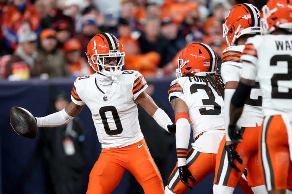 DENVER, COLORADO - DECEMBER 02: Greg Newsome II #0 of the Cleveland Browns celebrates a interception with teammates during the second quarter in the game against the Denver Broncos at Empower Field At Mile High on December 02, 2024 in Denver, Colorado.