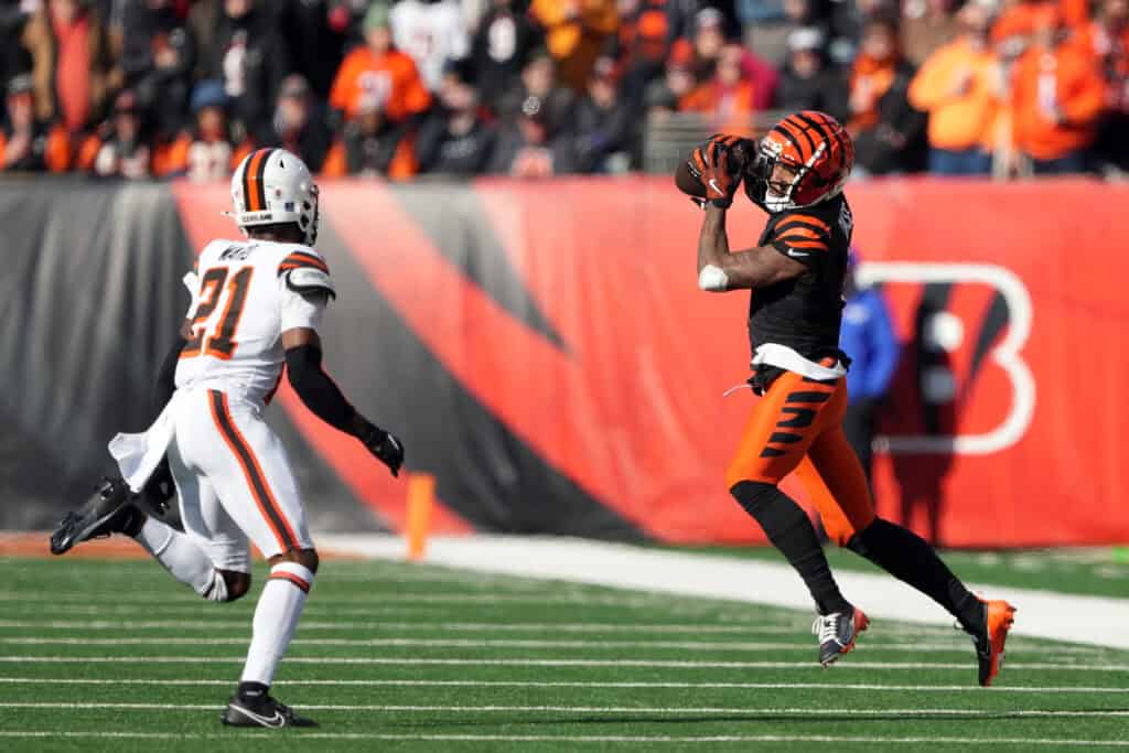 CINCINNATI, OHIO - DECEMBER 22: Ja'Marr Chase #1 of the Cincinnati Bengals makes a catch against Denzel Ward #21 of the Cleveland Browns during the first quarter at Paycor Stadium on December 22, 2024 in Cincinnati, Ohio.