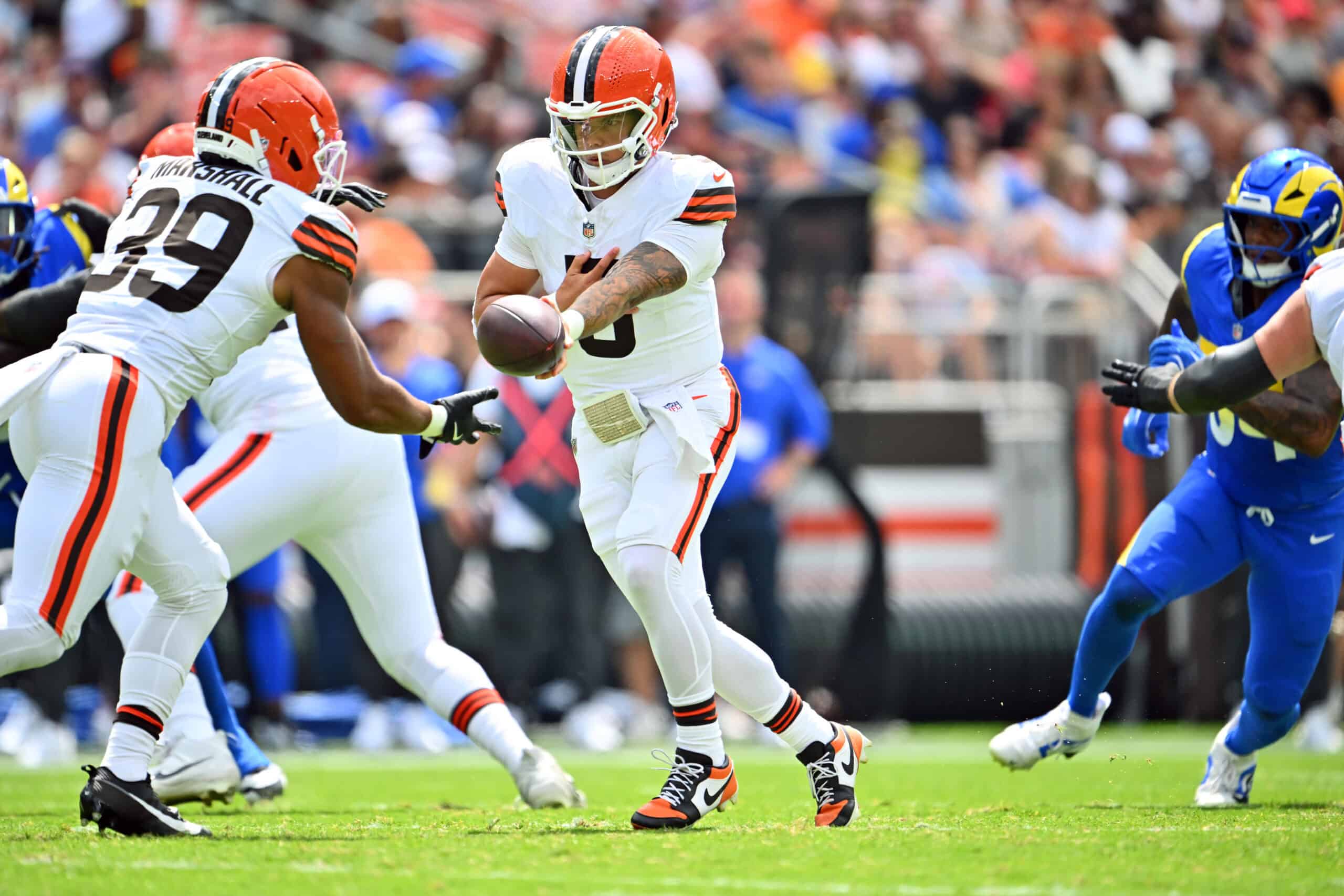 CLEVELAND, OHIO - AUGUST 23: Running back Ahmani Marshall #39 takes the hand off from quarterback Dillon Gabriel #5 of the Cleveland Browns during the first half of an NFL Preseason 2025 game against the Los Angeles Rams at Huntington Bank Field on August 23, 2025 in Cleveland, Ohio.