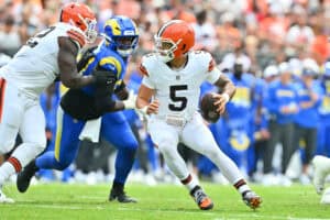 CLEVELAND, OHIO - AUGUST 23: Quarterback Dillon Gabriel #5 of the Cleveland Browns evades defenders during the first half of an NFL Preseason 2025 game against the Los Angeles Rams at Huntington Bank Field on August 23, 2025 in Cleveland, Ohio.