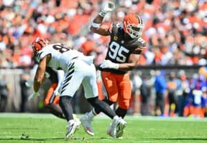 CLEVELAND, OHIO - SEPTEMBER 07: Myles Garrett #95 of the Cleveland Browns makes a move on Andrei Iosivas #80 of the Cincinnati Bengals during the second quarter during the game at Huntington Bank Field on September 07, 2025 in Cleveland, Ohio.