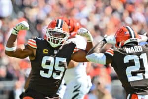 CLEVELAND, OHIO - SEPTEMBER 07: Myles Garrett #95 of the Cleveland Browns reacts with Denzel Ward #21 during the fourth quarter against the Cincinnati Bengals during the game at Huntington Bank Field on September 07, 2025 in Cleveland, Ohio.