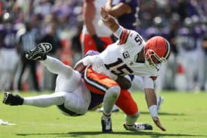 BALTIMORE, MARYLAND - SEPTEMBER 14: Nnamdi Madubuike #92 of the Baltimore Ravens hits Joe Flacco #15 of the Cleveland Browns after a pass during the second quarter at M&T Bank Stadium on September 14, 2025 in Baltimore, Maryland.