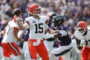 BALTIMORE, MARYLAND - SEPTEMBER 14: Joe Flacco #15 of the Cleveland Browns throws a pass as Nnamdi Madubuike #92 of the Baltimore Ravens pressures during the second quarter at M&T Bank Stadium on September 14, 2025 in Baltimore, Maryland.