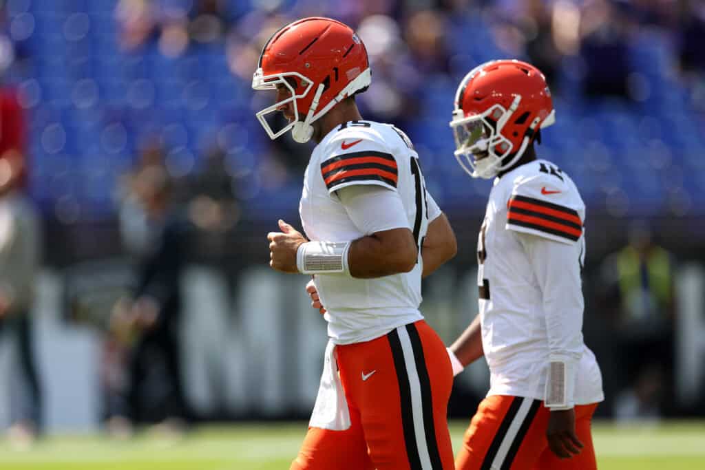 BALTIMORE, MARYLAND - SEPTEMBER 14: Quarterbacks Joe Flacco #15 and Shedeur Sanders #12 of the Cleveland Browns warm up against the Baltimore Ravens at M&T Bank Stadium on September 14, 2025 in Baltimore, Maryland.