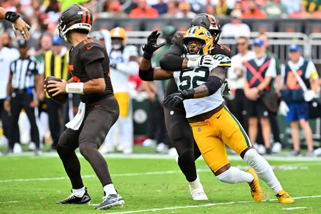 CLEVELAND, OHIO - SEPTEMBER 21: Kt Leveston #72 of the Cleveland Browns holds back Rashan Gary #52 of the Green Bay Packers during the third quarter at Huntington Bank Field on September 21, 2025 in Cleveland, Ohio.