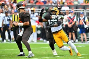 CLEVELAND, OHIO - SEPTEMBER 21: Kt Leveston #72 of the Cleveland Browns holds back Rashan Gary #52 of the Green Bay Packers during the third quarter at Huntington Bank Field on September 21, 2025 in Cleveland, Ohio.