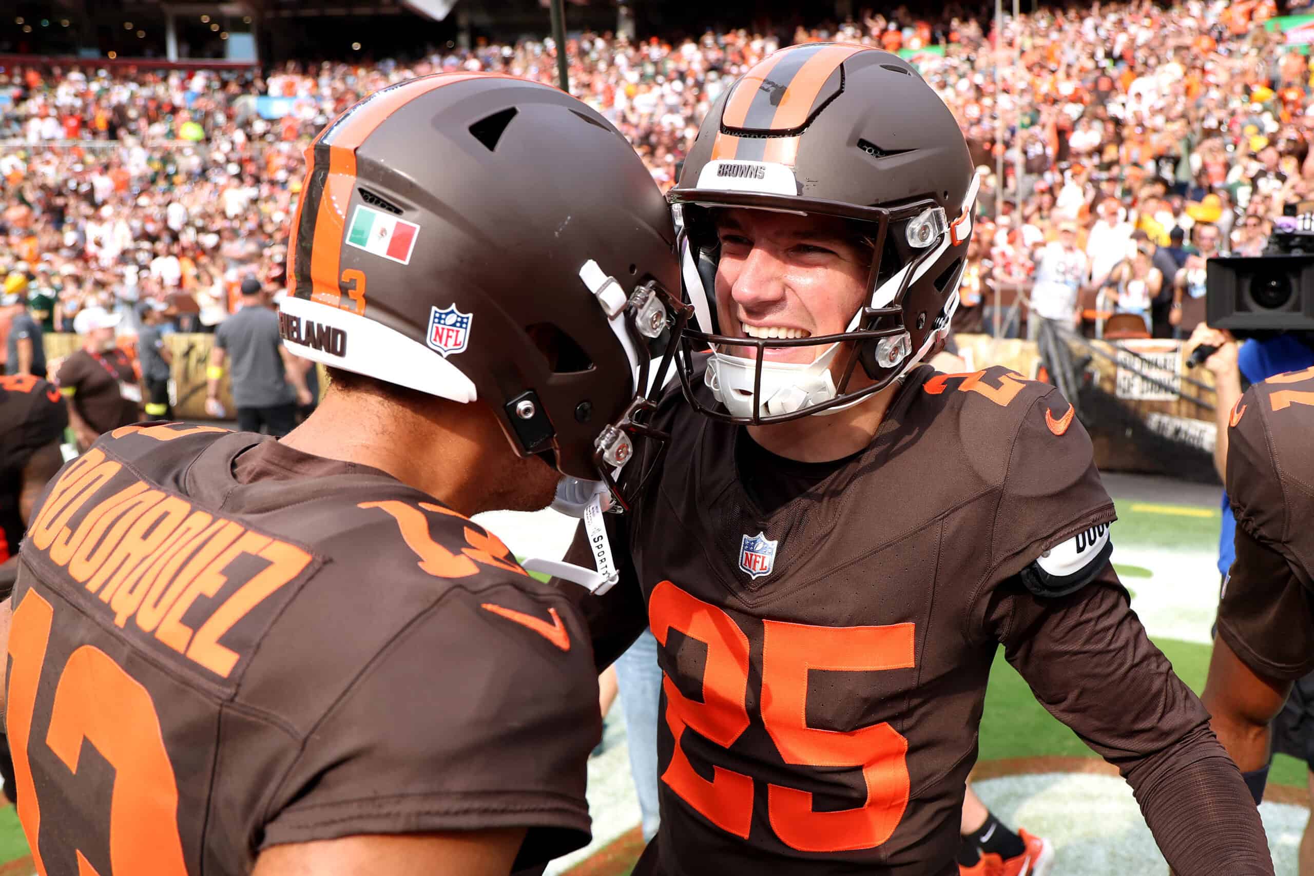 CLEVELAND, OHIO - SEPTEMBER 21: Andre Szmyt #25 of the Cleveland Browns celebrates after kicking the game winning field goal with Corey Bojorquez #13 during the fourth quarter against the Green Bay Packers at Huntington Bank Field on September 21, 2025 in Cleveland, Ohio.