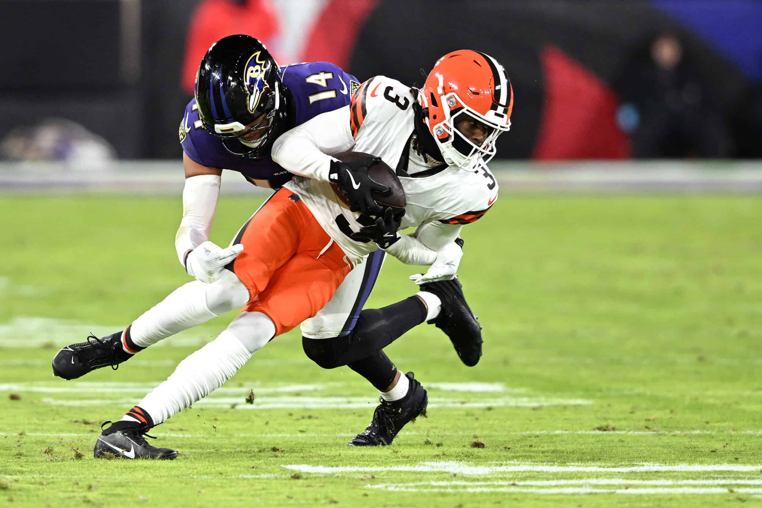 BALTIMORE, MARYLAND - JANUARY 04: Jerry Jeudy #3 of the Cleveland Browns evades the tackle of Kyle Hamilton #14 of the Baltimore Ravens during the third quarter at M&T Bank Stadium on January 04, 2025 in Baltimore, Maryland.