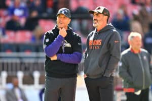 CLEVELAND, OHIO - OCTOBER 27: Head coach John Harbaugh of the Baltimore Ravens and head coach Kevin Stefanski of the Cleveland Browns talk prior to a game at Huntington Bank Field on October 27, 2024 in Cleveland, Ohio.
