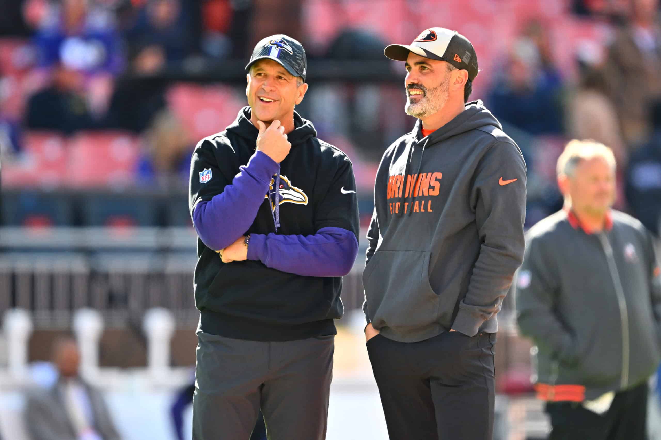 CLEVELAND, OHIO - OCTOBER 27: Head coach John Harbaugh of the Baltimore Ravens and head coach Kevin Stefanski of the Cleveland Browns talk prior to a game at Huntington Bank Field on October 27, 2024 in Cleveland, Ohio.