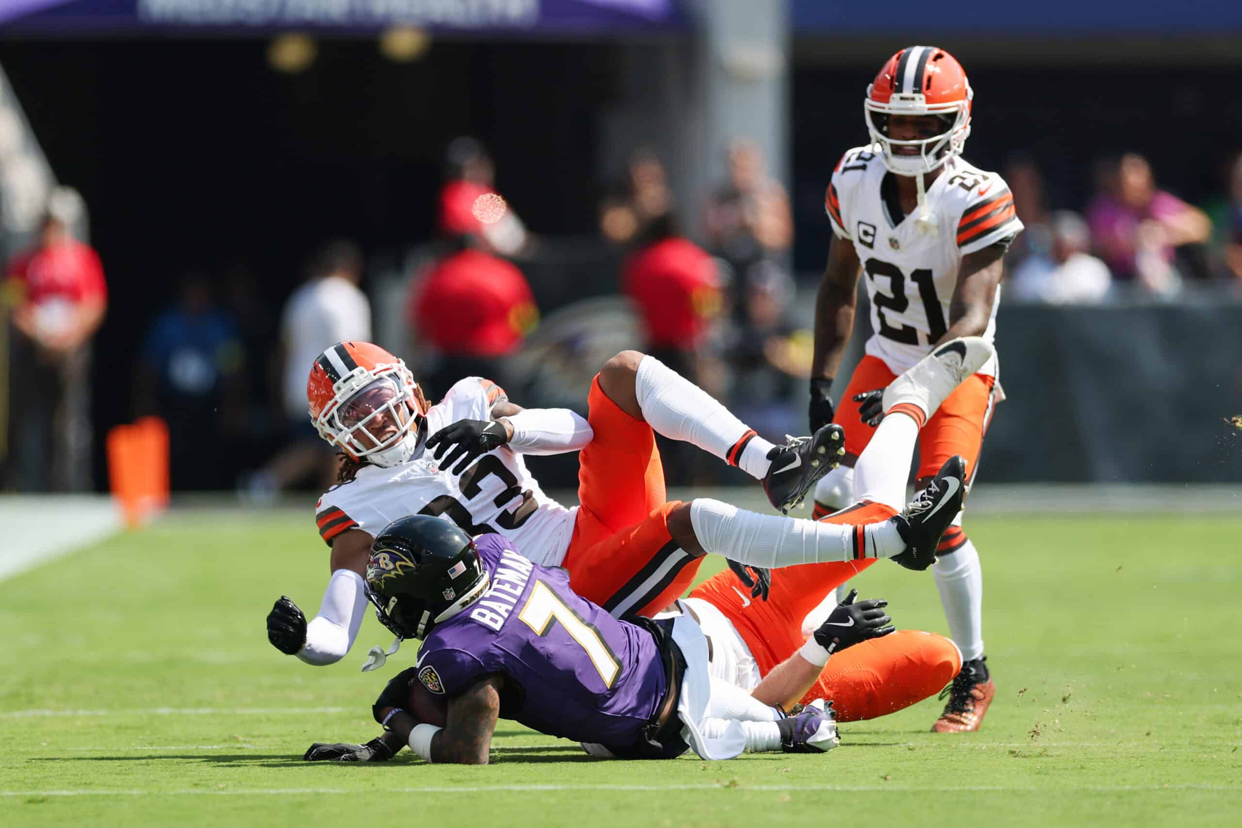 BALTIMORE, MARYLAND - SEPTEMBER 14: Rashod Bateman #7 of the Baltimore Ravens is tackled by Ronnie Hickman #33 of the Cleveland Browns after a pass reception during the first quarter at M&T Bank Stadium on September 14, 2025 in Baltimore, Maryland.
