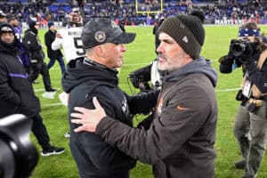BALTIMORE, MARYLAND - JANUARY 04: Head coaches John Harbaugh (L) of the Baltimore Ravens and Kevin Stefanski of the Cleveland Browns shake hands after the game at M&T Bank Stadium on January 04, 2025 in Baltimore, Maryland.