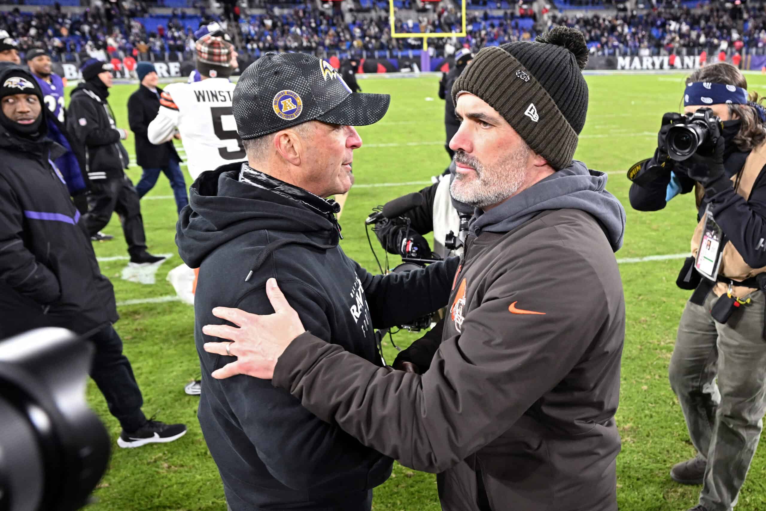 BALTIMORE, MARYLAND - JANUARY 04: Head coaches John Harbaugh (L) of the Baltimore Ravens and Kevin Stefanski of the Cleveland Browns shake hands after the game at M&T Bank Stadium on January 04, 2025 in Baltimore, Maryland.