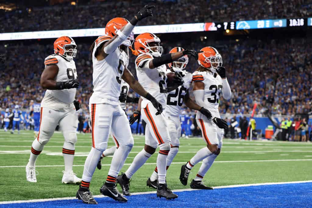 DETROIT, MICHIGAN - SEPTEMBER 28: Denzel Ward #21 of the Cleveland Browns celebrates an interception with teammates during the third quarter against the Detroit Lions at Ford Field on September 28, 2025 in Detroit, Michigan.
