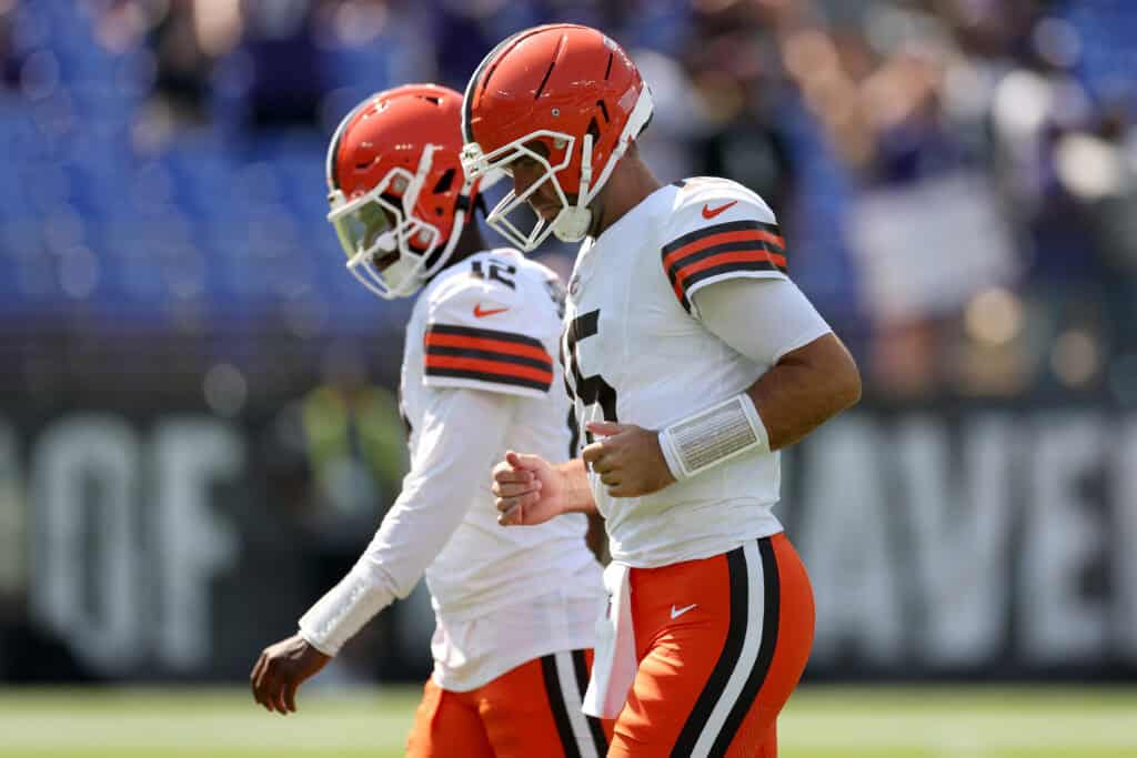 BALTIMORE, MARYLAND - SEPTEMBER 14: Shedeur Sanders #12 and Joe Flacco #15 of the Cleveland Browns warm up prior to a game against the Baltimore Ravens at M&T Bank Stadium on September 14, 2025 in Baltimore, Maryland.