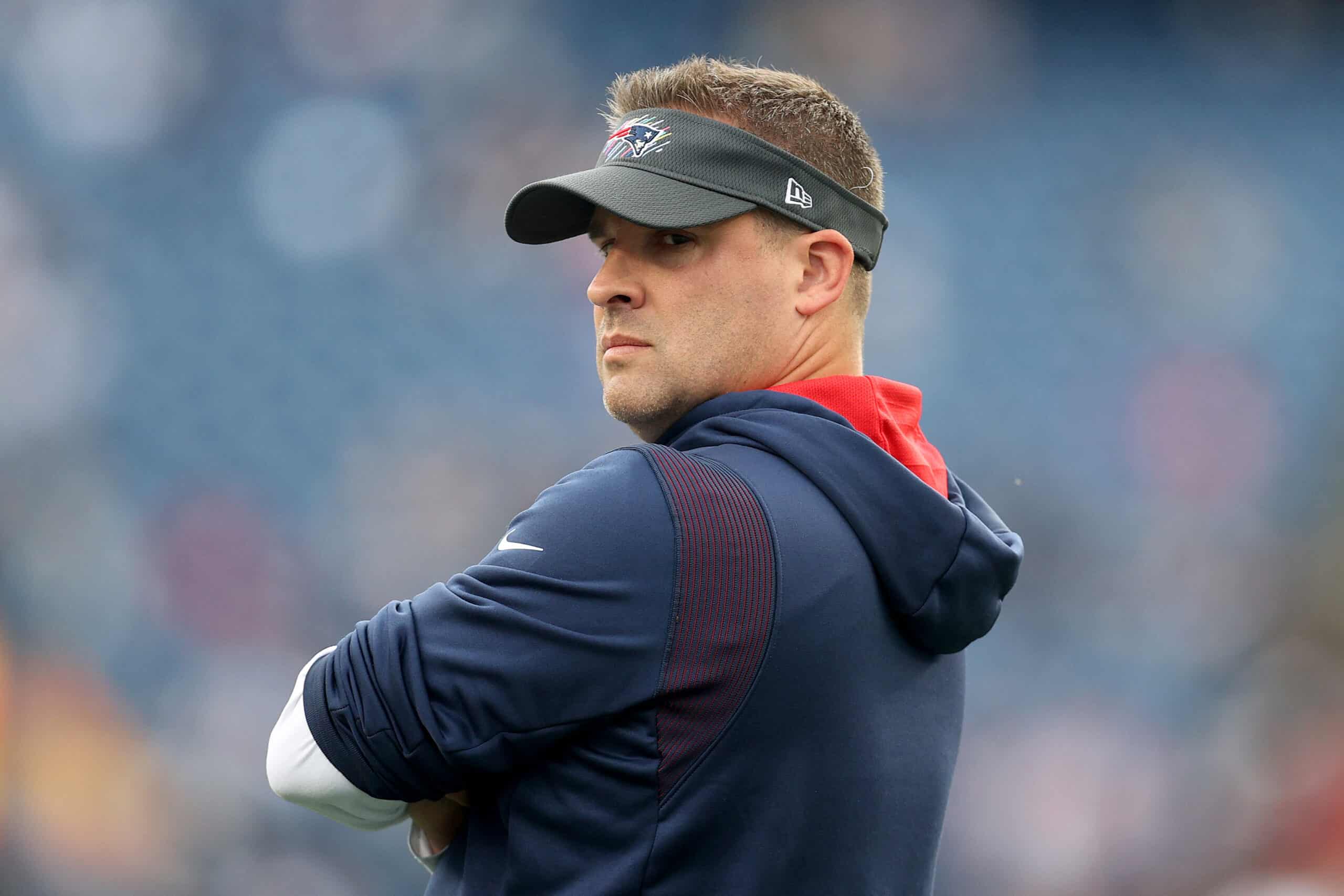 FOXBOROUGH, MASSACHUSETTS - OCTOBER 17: New England Patriots offensive coordinator Josh McDaniels stands on the field before their game against the Dallas Cowboys at Gillette Stadium on October 17, 2021 in Foxborough, Massachusetts.