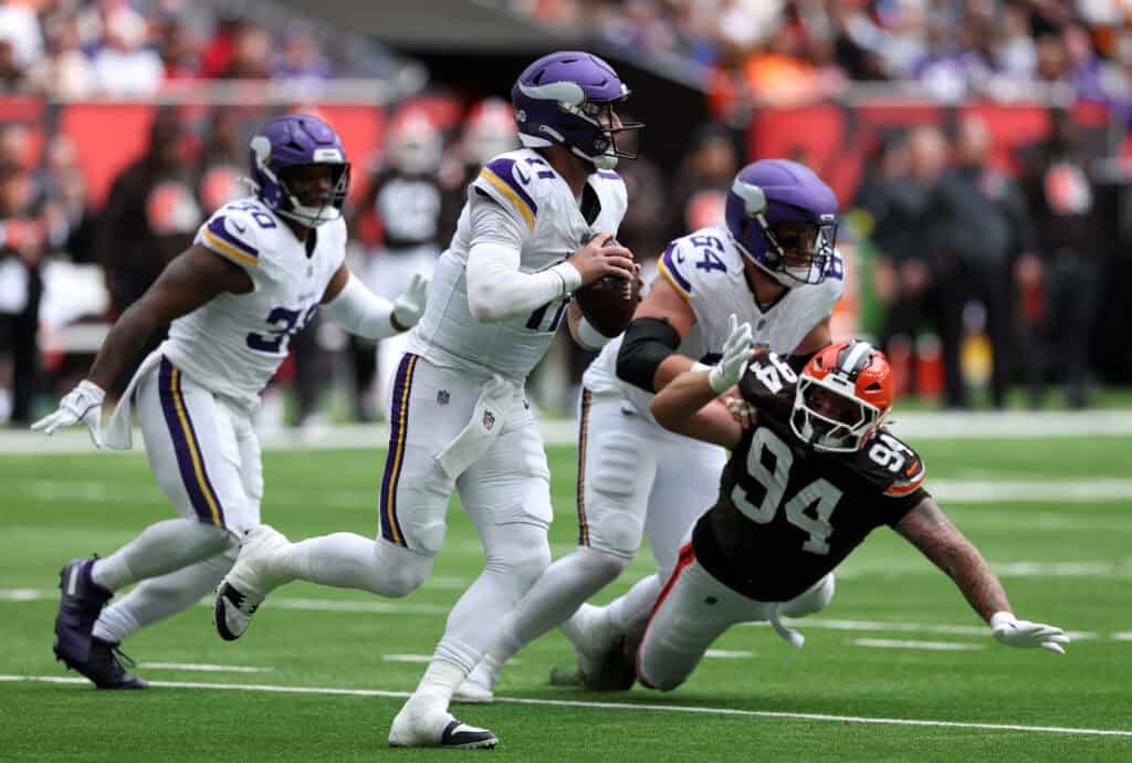 LONDON, ENGLAND - OCTOBER 05: Carson Wentz of Minnesota Vikings looks to throw a pass during the second quarter in the NFL 2025 game between Minnesota Vikings and Cleveland Browns at Tottenham Hotspur Stadium on October 05, 2025 in London, England.""