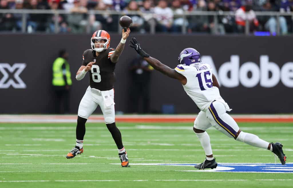 LONDON, ENGLAND - OCTOBER 05: Dillon Gabriel of Cleveland Browns throws a pass under pressure from Dallas Turner of Minnesota Vikings during the fourth quarter in the NFL 2025 game between Minnesota Vikings and Cleveland Browns at Tottenham Hotspur Stadium on October 05, 2025 in London, England.""