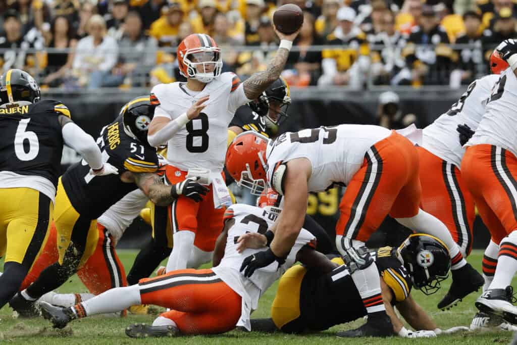 PITTSBURGH, PENNSYLVANIA - OCTOBER 12: Dillon Gabriel #8 of the Cleveland Browns throws under pressure from Nick Herbig #51 of the Pittsburgh Steelers during the first quarter in the game at Acrisure Stadium on October 12, 2025 in Pittsburgh, Pennsylvania.