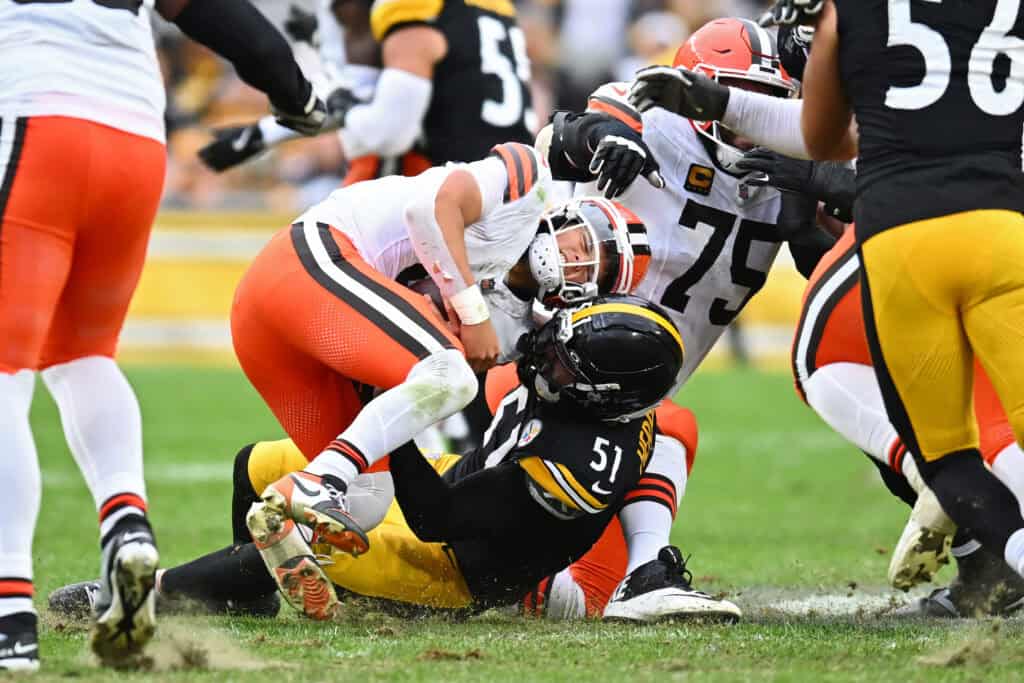 PITTSBURGH, PENNSYLVANIA - OCTOBER 12: Dillon Gabriel #8 of the Cleveland Browns is sacked by Nick Herbig #51 of the Pittsburgh Steelers during the fourth quarter in the game at Acrisure Stadium on October 12, 2025 in Pittsburgh, Pennsylvania