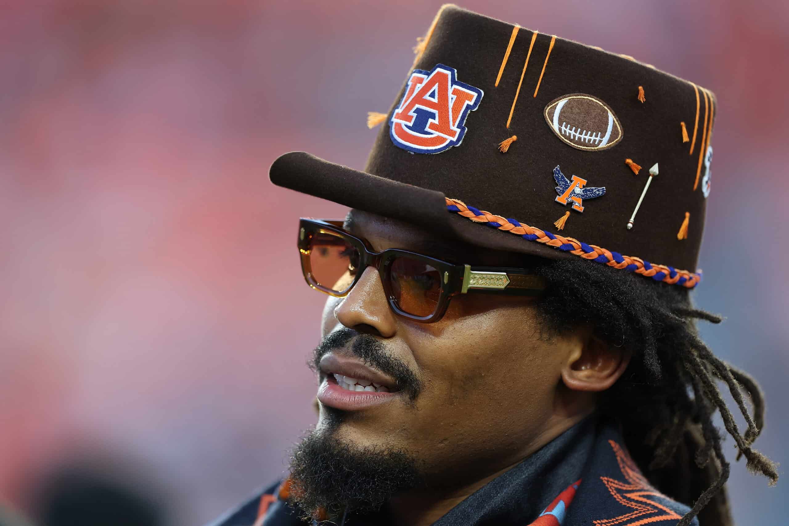 AUBURN, ALABAMA - OCTOBER 11: Former Auburn Tigers quarterback Cam Newton looks on during pregame warmups prior to the game between the Auburn Tigers and the Georgia Bulldogs at Jordan-Hare Stadium on October 11, 2025 in Auburn, Alabama.