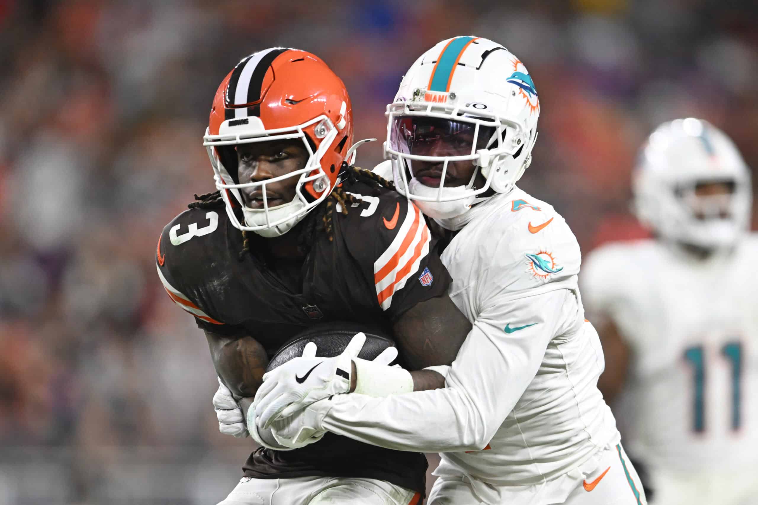 CLEVELAND, OHIO - DECEMBER 29: Jerry Jeudy #3 of the Cleveland Browns is tackled by Kader Kohou #4 of the Miami Dolphins during the third quarter at Huntington Bank Field on December 29, 2024 in Cleveland, Ohio.