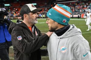 CLEVELAND, OHIO - DECEMBER 29: Head coach Kevin Stefanski of the Cleveland Browns and head coach Mike McDaniel of the Miami Dolphins embrace after the game at Huntington Bank Field on December 29, 2024 in Cleveland, Ohio.