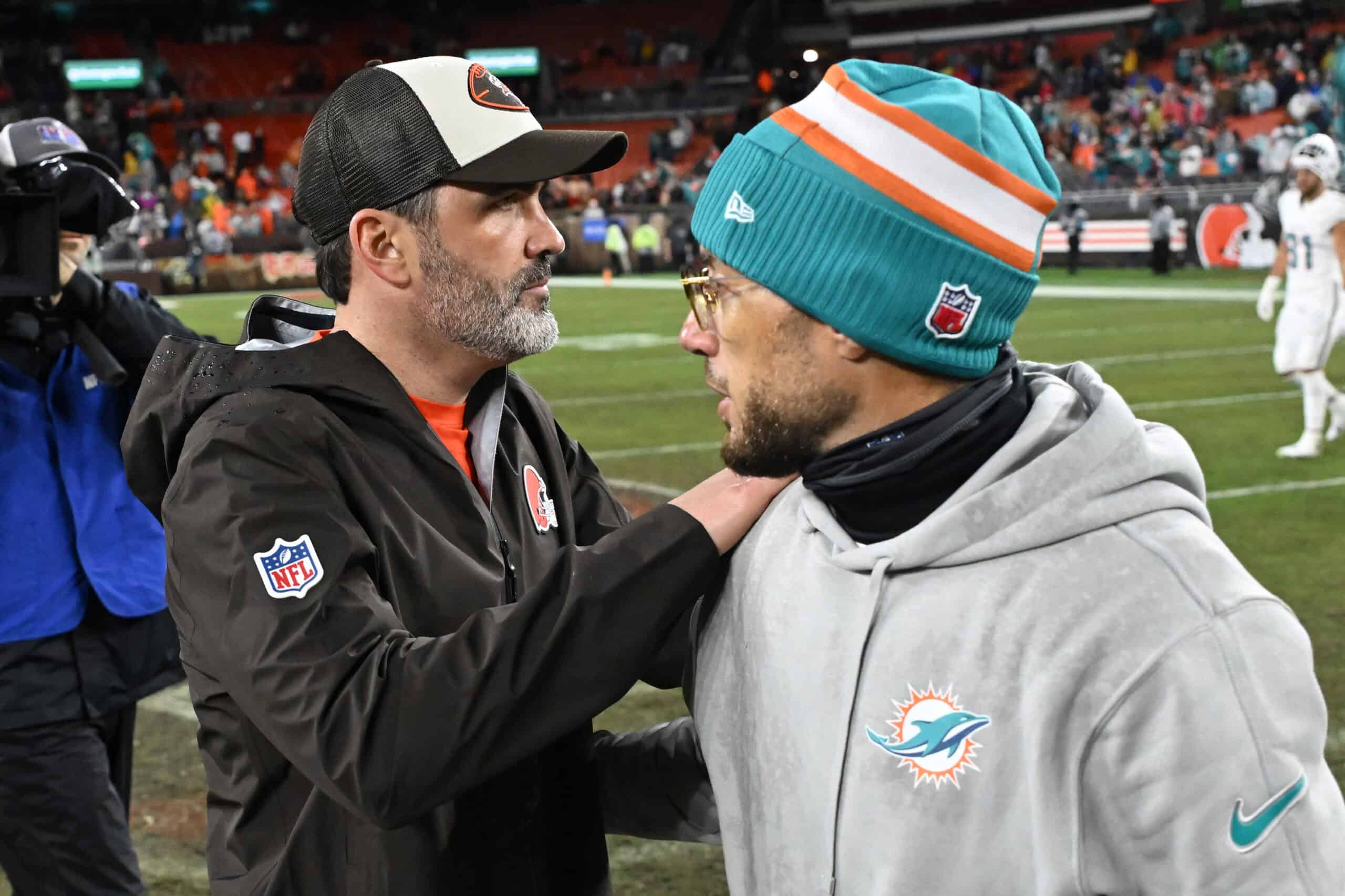 CLEVELAND, OHIO - DECEMBER 29: Head coach Kevin Stefanski of the Cleveland Browns and head coach Mike McDaniel of the Miami Dolphins embrace after the game at Huntington Bank Field on December 29, 2024 in Cleveland, Ohio.